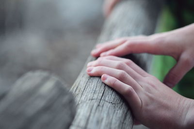 Low section of woman touching feet