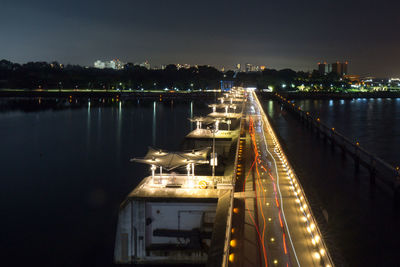 High angle view of illuminated bridge over river at night