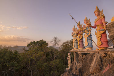 Statue of buddha against sky