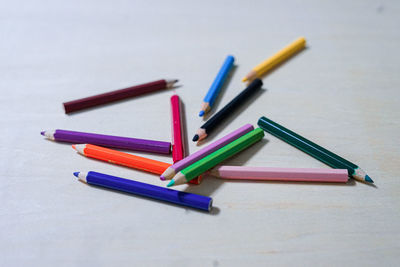 High angle view of colored pencils on table