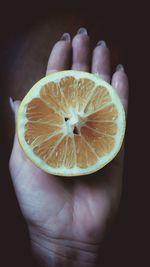 Close-up of hand holding ice cream