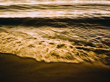 High angle view of surf on the beach