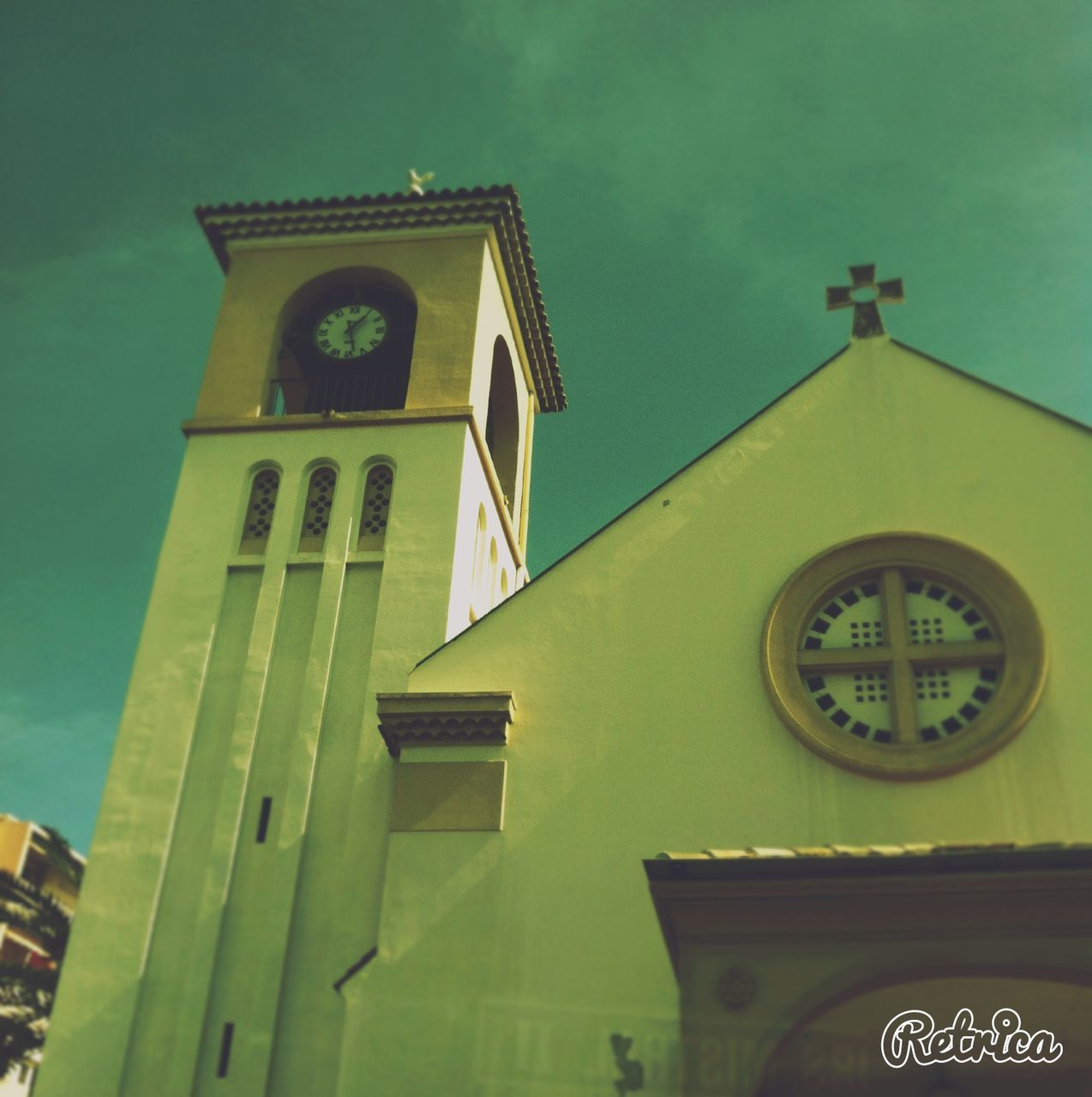 architecture, building exterior, religion, church, built structure, low angle view, place of worship, spirituality, cross, window, cathedral, sky, clock tower, clock, high section, no people, facade, outdoors