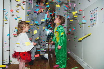 Group of people standing against wall