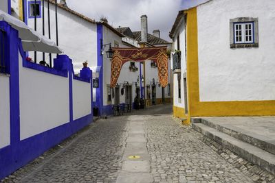 Alley amidst buildings in city