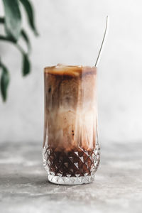 Close-up of coffee in glass jar on table