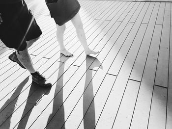 Low section of people walking on footpath