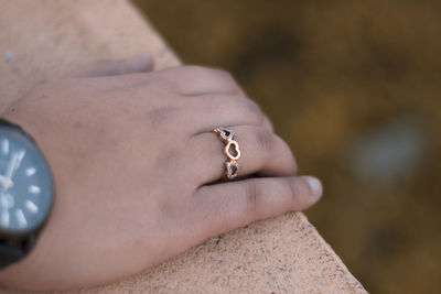 Close-up of hand on railing