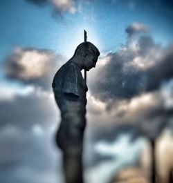 Low angle view of statue against sky