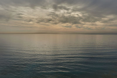 Scenic view of sea against sky at sunset