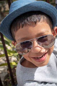 Close-up of boy wearing sunglasses