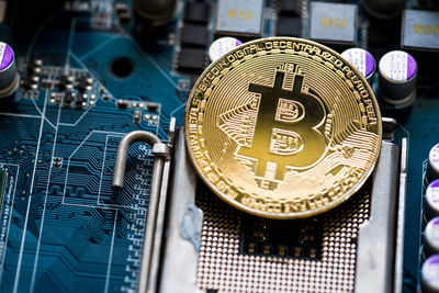 Close-up of bitcoin on circuit board