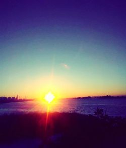 Scenic view of sea against clear sky during sunset