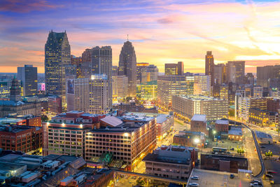 High angle view of buildings in city against sky during sunset