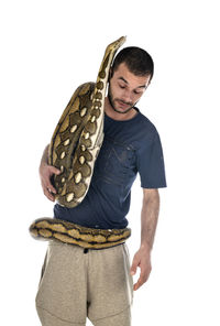 Mid adult man standing against white background