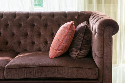 Close-up of sofa on table at home