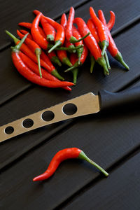 High angle view of chili peppers on cutting board
