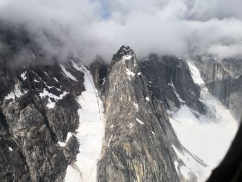 Panoramic view of snowcapped mountains against sky