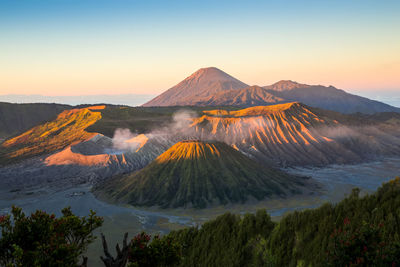 Scenic view of mountain range against sky during sunset