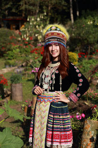 Portrait of a smiling young woman wearing hat