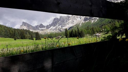 Scenic view of landscape and mountains against sky