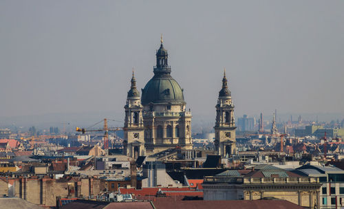 View of buildings in city against sky