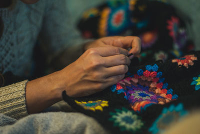 Close-up of woman knitting wool