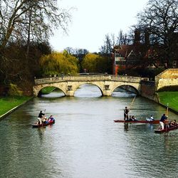 Tourists on bridge over river