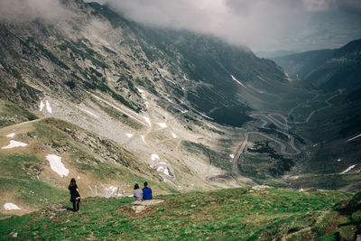 Rear view of people on mountain range