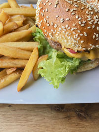 Close-up of burger and vegetables on table