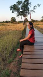 Woman sitting on field