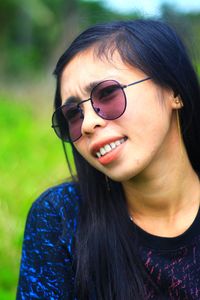 Close-up of young woman wearing sunglasses