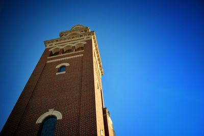 Low angle view of tower against blue sky