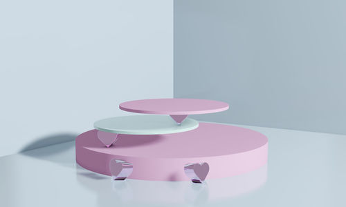 Close-up of heart shape on table against white background