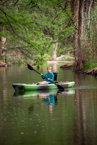 Girl in a canoe on water