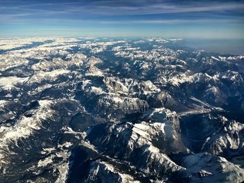 Aerial view of landscape and sea against sky
