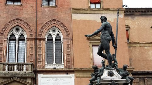 Statue in front of building