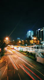 Light trails on city street at night