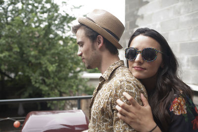 Portrait of young couple with sunglasses