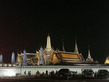 View of illuminated temple building against sky at night