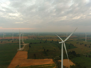 Scenic view of field against sky during sunset