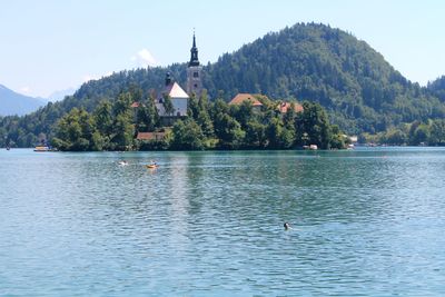 Scenic and picturesque view of lake bled in the julian alps and mountains against sky. 