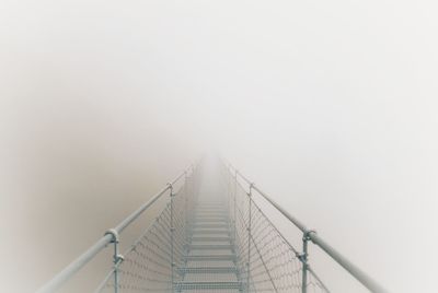 Rope bridge during foggy weather