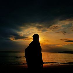 Silhouette of man at sunset