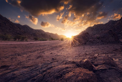 Scenic view of mountains against sky during sunset