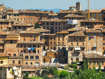 Cityscape of siena a wonderful city in tuscany and its medieval buildings seen from orto dei tolomei