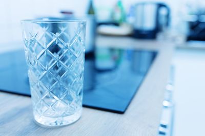 Close-up of glass glasses on table