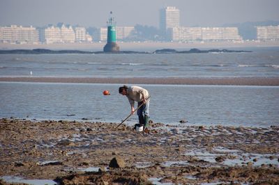 Full length of man on beach against sky