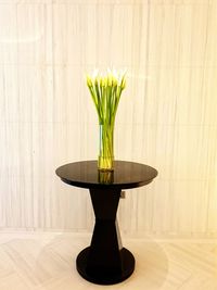 Flower vase on table at home