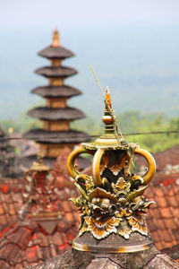 Close-up of temple against sky